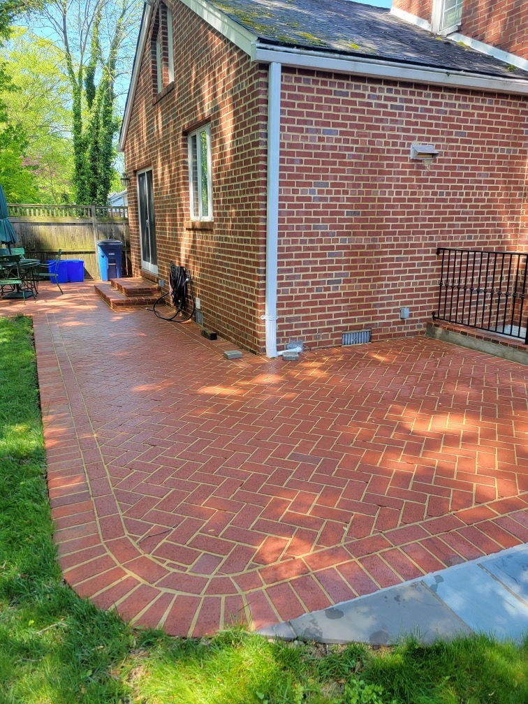 Same brick patio after pressure washing by Windows Only