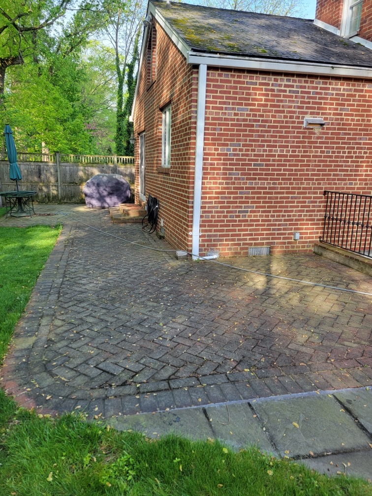 Brick patio before pressure washing